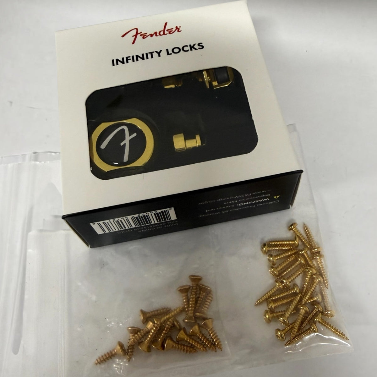 Set of Fender Infinity Strap Locks in Gold with Guitar Tuner & Pickguard Screws